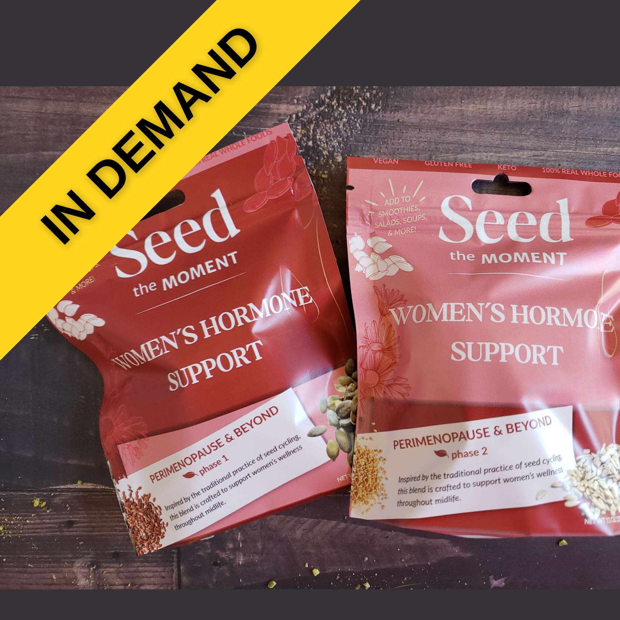 Two packages of 'Seed the Moment Women's Hormone Support' on a wooden surface with a yellow banner.