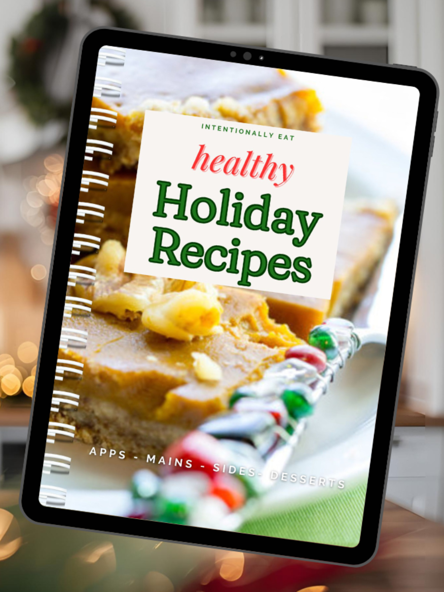 Tablet displaying a 'Healthy Holiday Recipes' book with a blurred festive background